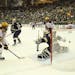 Notre Dame goalie Cal Peterson looked back as the puck shot by Mike Reoilly sailed into the net for the Gophers' third goal in the first period Sunday