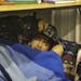 Having slept poorly the night before and arrived to a cold classroom Bug-O-Nay-Ge-Shig High School student Irvin Kingbird, a senior, curled up with a 