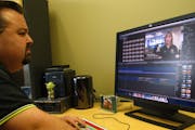 Justin Atkinson, a producer for South Washington County Telecommunications Commission, edits a video.