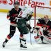 The Senators’ Jared Cowen checked the Wild’s Nino Niederreiter in front of the net Thursday.
