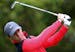 Northern Ireland's Rory McIlroy watches his tee shot during the first round of the Australian Open golf championship in Sydney, Australia Thursday, No