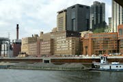 A 2003 view of the St. Paul riverfront, seen from the south side of the Mississippi River and under the Wabasha Street Bridge, shows the Ramsey County