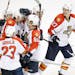 Florida Panthers center Nick Bjugstad (27), right, is congratulated by teammates after he scored a goal to tie the game against the Nashville Predator