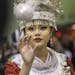 Gaoshoua Moua of Rochester wears Hmong Chinese decor while participating in the ball toss at the Minnesota Hmong New Year celebration Saturday, Nov. 2