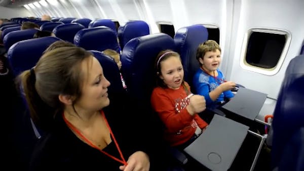 Kids board plane to see Santa