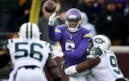 Minnesota Vikings quarterback Teddy Bridgewater (5) threw an incomplete pass in the third quarter as he was pressured by New York Jets defensive end S