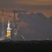 NASA's Orion spacecraft, atop a United Launch Alliance Delta 4-Heavy rocket, sits on the launch pad before its first scheduled unmanned orbital test f