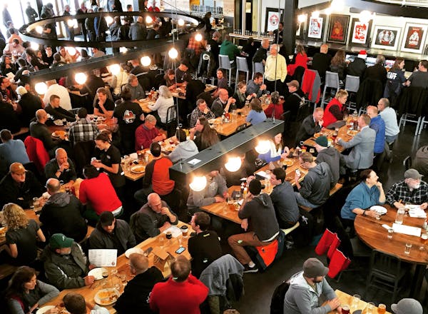Fans dive in at opening day of Surly's new destination brewery in Minneapolis on Dec. 19, 2014.