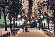 A mystery couple was engaged in Rice Park in St. Paul on Thursday, December 18, 2014 at around 10 p.m., and Joy Son of Minneapolis captured the moment