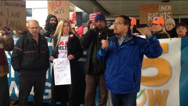 Kip Hedges stands next to Rep. Keith Ellison at a recent demonstration at the Minneapolis-St. Paul Airport.