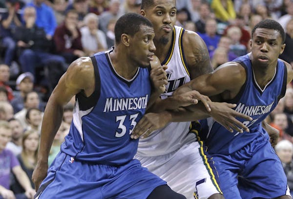 Wolves forward Thaddeus Young (33) battled for position with Utah’s Derrick Favors. Later Young blamed himself for Tuesday’s loss.