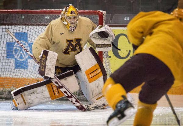 Goalie Adam Wilcox — tracking a shot in practice above — has been reliable in the Gophers’ net for 2½ seasons.