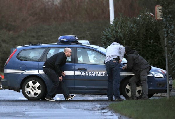Charlie Hebdo suspects are cornered with hostage