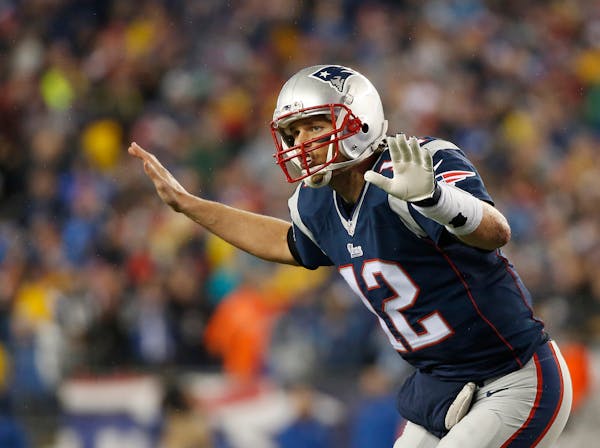 New England Patriots quarterback Tom Brady (12) calls a play during the first half of the NFL football AFC Championship game against the Indianapolis 