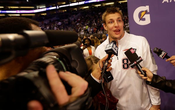 New England Patriots' Rob Gronkowski answers questions during media day for NFL Super Bowl XLIX football game Tuesday, Jan. 27, 2015, in Phoenix. (AP 