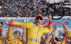 Joey Logano celebrates in Victory Lane after winning the Daytona 500 NASCAR Sprint Cup series auto race at Daytona International Speedway, Sunday, Feb