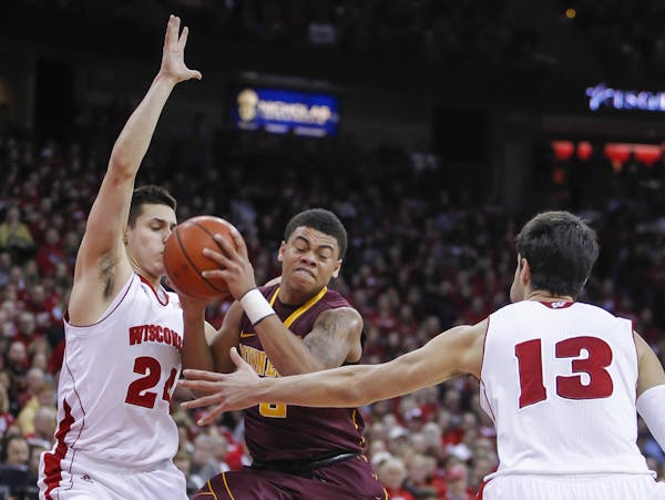 Gophers freshman Nate Mason, center, battled between Wisconsin's Bronson Koenig, left, and Duje Dukan (21) during a Feb. 21, 2015, game in Madison, Wi