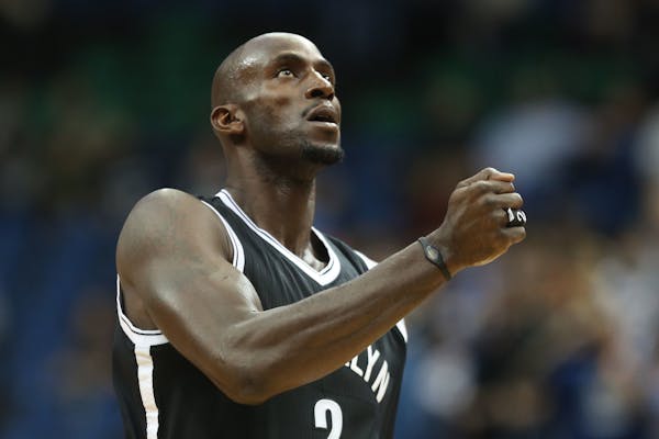 The Nets' Kevin Garnett acknowledged the crowd before the first half at the Target Center in Minneapolis. Garnett, who was drafted by the Wolves in 19