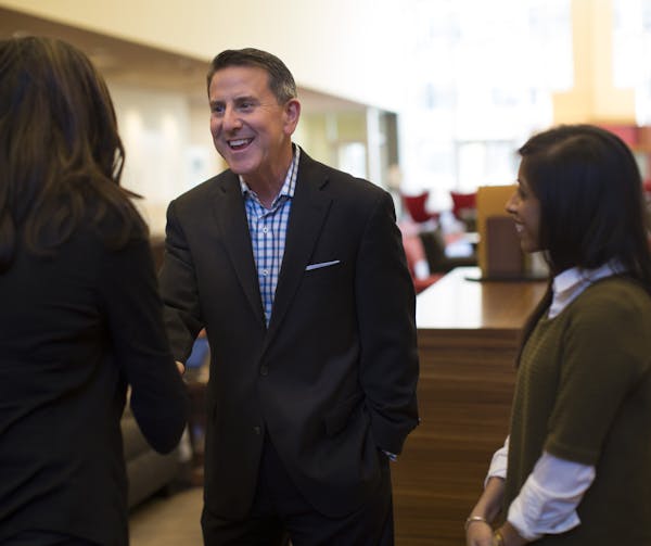 Target CEO Brian Cornell greeted employees Rina Hurst (senior buyer) and Anishaa Janardan Janardan at Target headquarters in February.