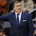Minnesota Timberwolves head coach Flip Saunders motions to his team during the first half of an NBA basketball game against the Phoenix Suns, Friday, 