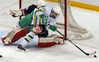 Edina's Dylan Malmquist skated around Lakeville North goalie Jake Oettinger as he attempted a shot in last year's Class 2A boys' hockey championship g