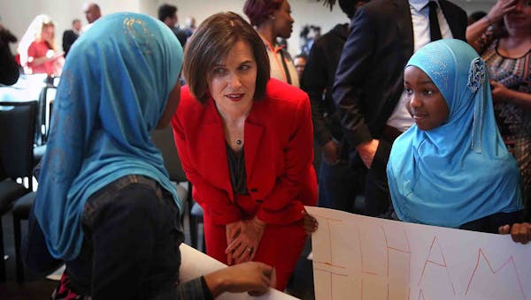 Mayor Betsy Hodges spoke with Mohamed Barre’s 9-year-old twins, Ilham and Ilhan, all of whom attended the State of the City address.