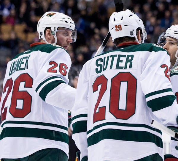 The Wild's Thomas Vanek, left, celebrated with Ryan Suter (20) and Justin Fontaine after scoring at Toronto last week.