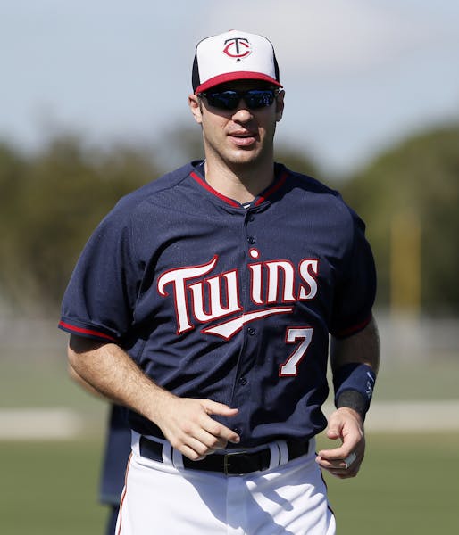 Minnesota Twins first baseman Joe Mauer (7) warms up at baseball spring training in Fort Myers, Fla., March 3, 2015.