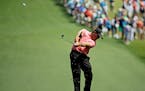 Phil Mickelson hits off the first fairway during the third round of the Masters golf tournament Saturday, April 11, 2015, in Augusta, Ga.