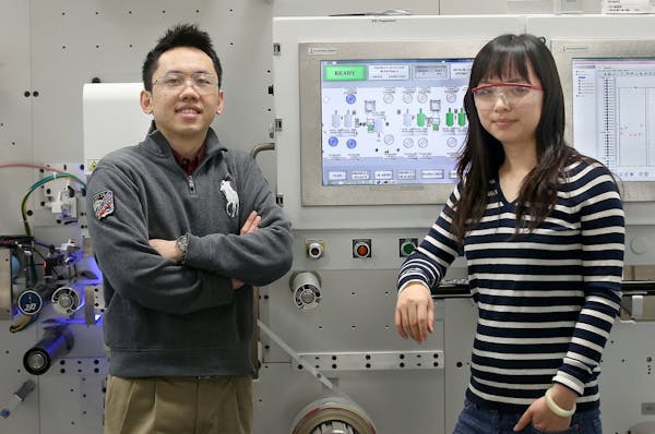 Au ChunXing, left, from Malaysia and Yahui Zhang from China, work as engineers at LasX Industries. Experts are predicting another short application se