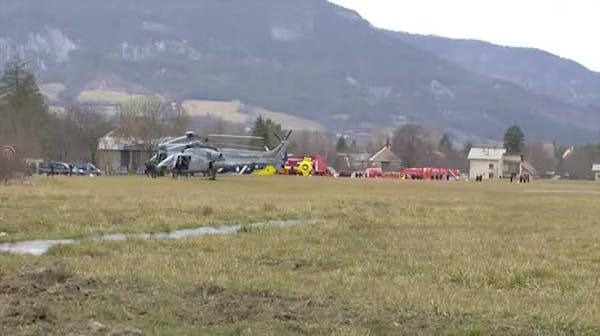 Rescue teams gather near plane crash site