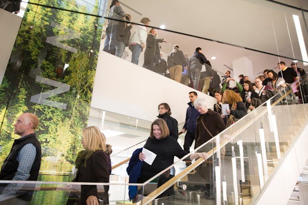 Star Tribune employees tour the new offices inside the Capella Tower in downtown Minneapolis on Thursday, March 5, 2015.