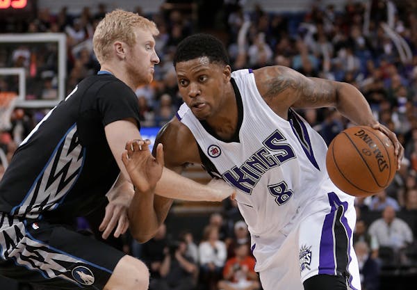 Kings forward Rudy Gay drove against Wolves forward Chase Budinger during the second half of Sacramento's 116-105 victory Tuesday night.
