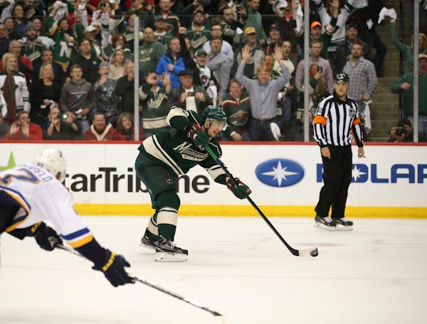 Minnesota Wild right wing Nino Niederreiter (22) took careful aim as he scored an empty net goal against the Blues.