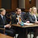 Sen. Scott Dibble, flanked by Beagle Freedom Project President Shannon Keith, right, at a 2013 hearing on a lab animal adoption bill.