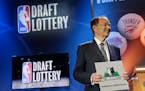 Minnesota Timberwolves owner Glen Miller poses for photos after the Timberwolves won the No. 1 pick in the NBA basketball draft lottery Tuesday, May 1