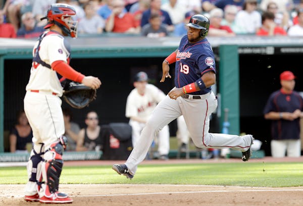 Minnesota Twins' Kennys Vargas (19) scores on an RBI-single from Eddie Rosari in the third inning of a baseball game against the Cleveland Indians, Sa