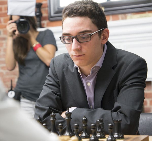 Fabiano Caruana playing in the 2014 Sinquefield Cup at the Chess Club and Scholastic Center of St. Louis.