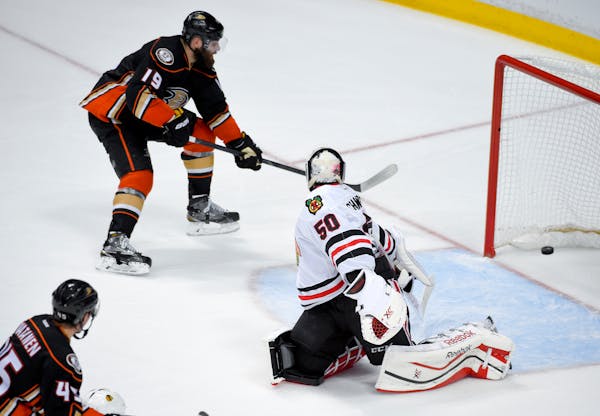 Ducks left winger Patrick Maroon, left, scored past Blackhawks goalie Corey Crawford during the third period in Game 5 of the Western Conference final