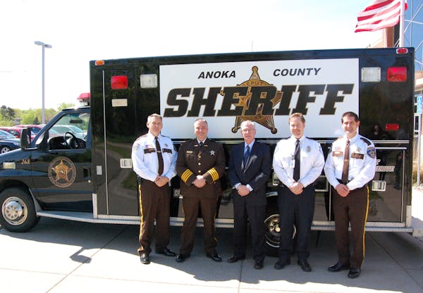 Anoka County Sheriff’s Office Chief Deputy Tom Wells, Sheriff James Stuart, Bill Snoke, Jeff Czyson (both from Allina Health) and Cmdr. Brian Podany