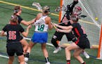 Blake's Lydia Sutton (18) threaded her way through Eden Prairie defenders to score a first-half goal in last year's girls' lacrosse state championship