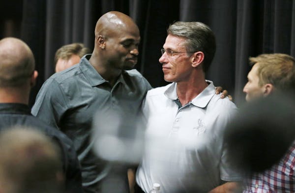 Viking running back Adrian Peterson hugged Vikings GM Rick Spielman after speaking to the media during a press conference at Winter Park Monday June 2