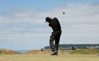 Phil Mickelson hits his tee shot on the 10th hole during a practice round for the U.S. Open golf tournament at Chambers Bay on Tuesday, June 16, 2015 