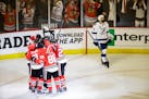 Chicago Blackhawks players celebrate a goal by left wing Brandon Saad (20) to take the lead, 2-1, during the third period of Game 4 of the Stanley Cup