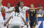 United States' Christen Press (23) celebrates her goal against Australia with Lauren Holiday (12) during a FIFA Women's World Cup soccer match in Winn