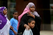 Ayan Farah walked away from the Federal Courthouse with family and friends Thursday in Minneapolis.
