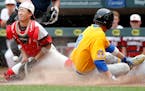 Camren Dehler (8) of St. Cloud Cathedral slid safely in home past Minnehaha Academy catcher Alan Ho (1) in the second inning of Monday's Class 2A stat