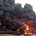 A derailed oil train burns near Heimdal, N.D., Wednesday, forcing the evacuation of nearby homes and farms.