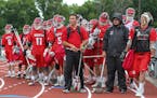 Coach Jeff Wright, center, waited to lead his Lakeville North team onto the field for the state boys' lacrosse semifinal on June 11.