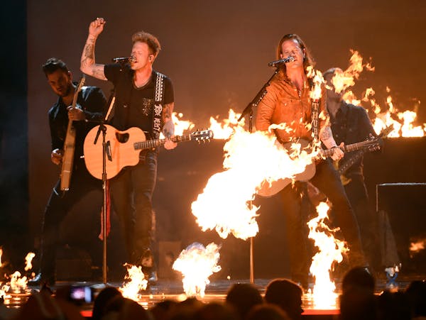 Brian Kelley, left, and Tyler Hubbard, of Florida Georgia Line, perform at the 50th annual Academy of Country Music Awards at AT&T Stadium on Sunday, 